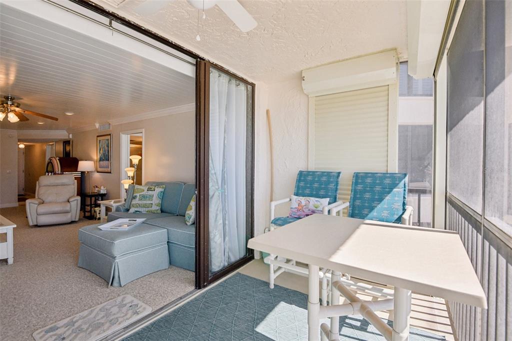 18304 Gulf Boulevard, Unit 607 Redington Shores, FL 33708 - Photo 19 of 30 a living room with furniture and a table