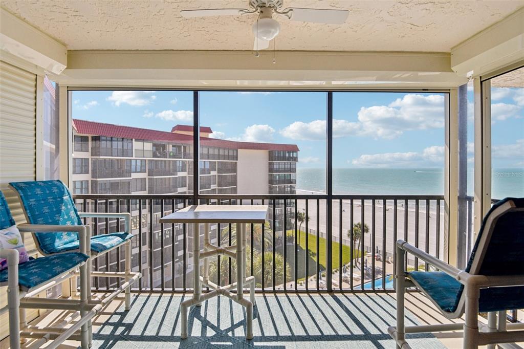 18304 Gulf Boulevard, Unit 607 Redington Shores, FL 33708 - Photo 5 of 30 a view of a balcony with floor to ceiling windows with wooden floor