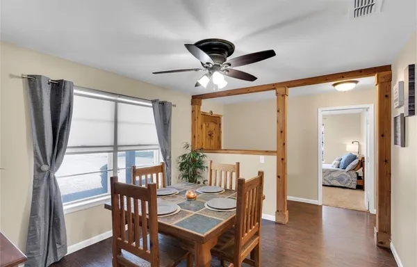 a view of a livingroom with furniture window and wooden floor