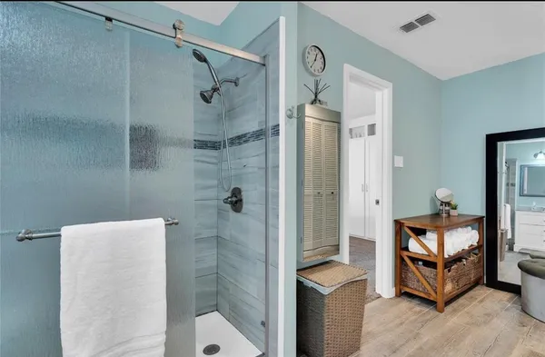 a bathroom with a shower and toilet