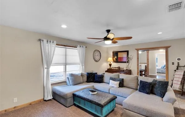 a living room with furniture and a large window