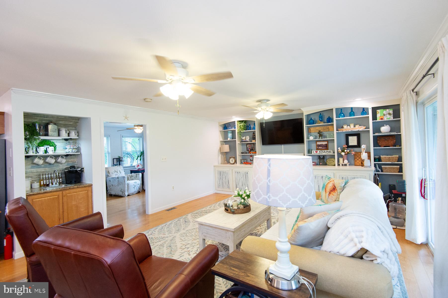 12136 Holly Road Ridgely, MD 21660 - Photo 14 of 136 a living room with furniture kitchen view and a large window