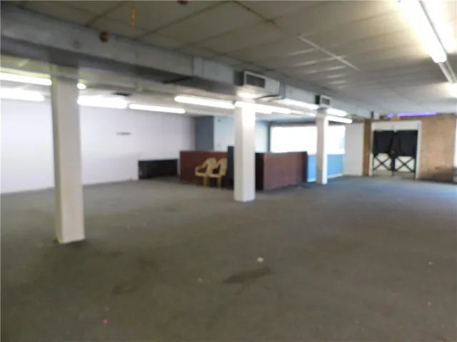 a view of a livingroom with furniture and a ceiling fan