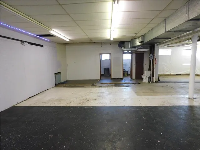 a view of a hallway with stairs