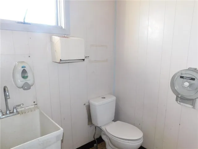 a bathroom with a toilet and a sink