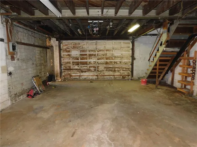 a view of empty room with wooden ceiling