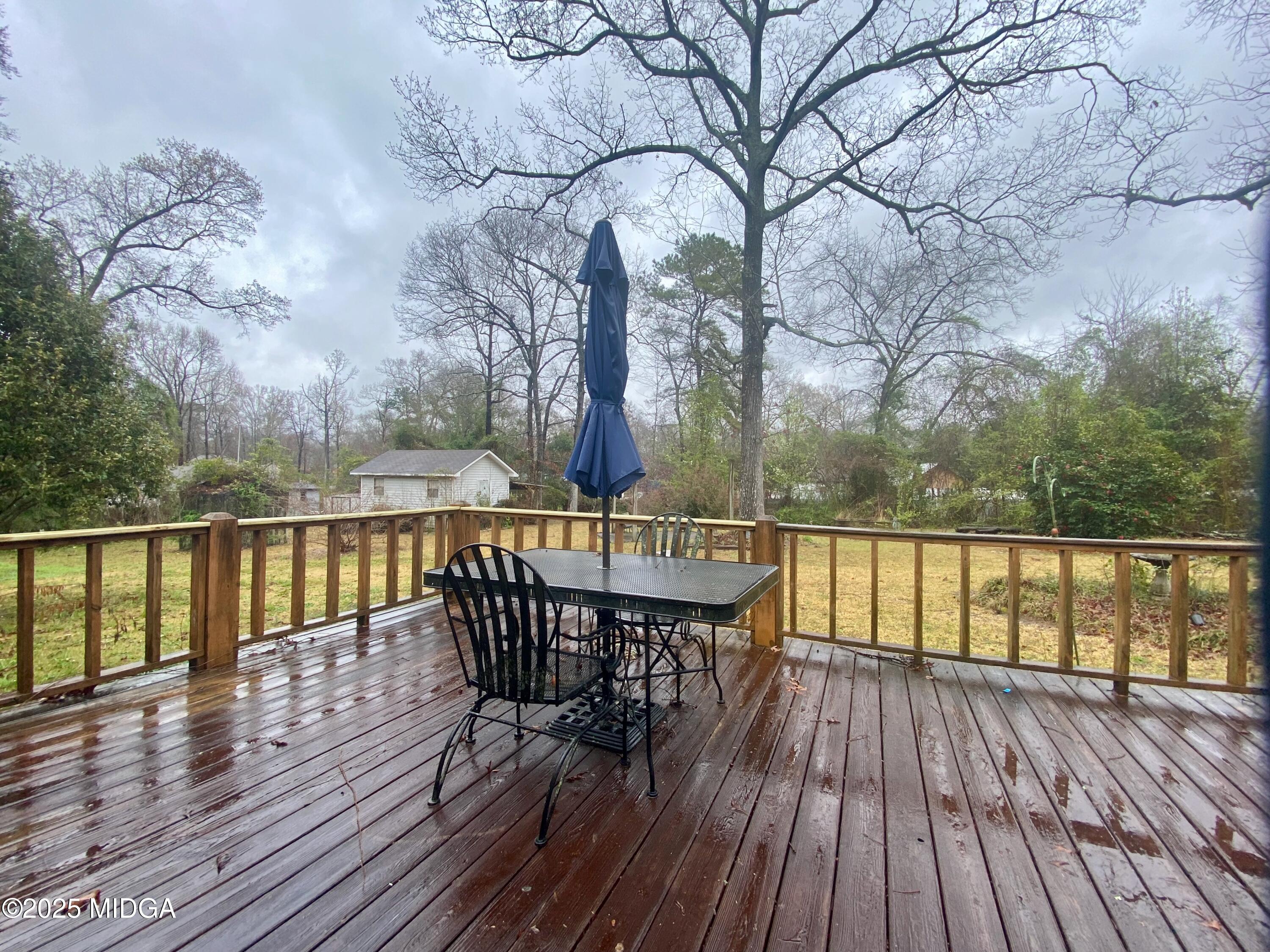 727 Walker Road Byron, GA 31008 - Photo 13 of 23 a view of balcony with wooden floor and outdoor seating