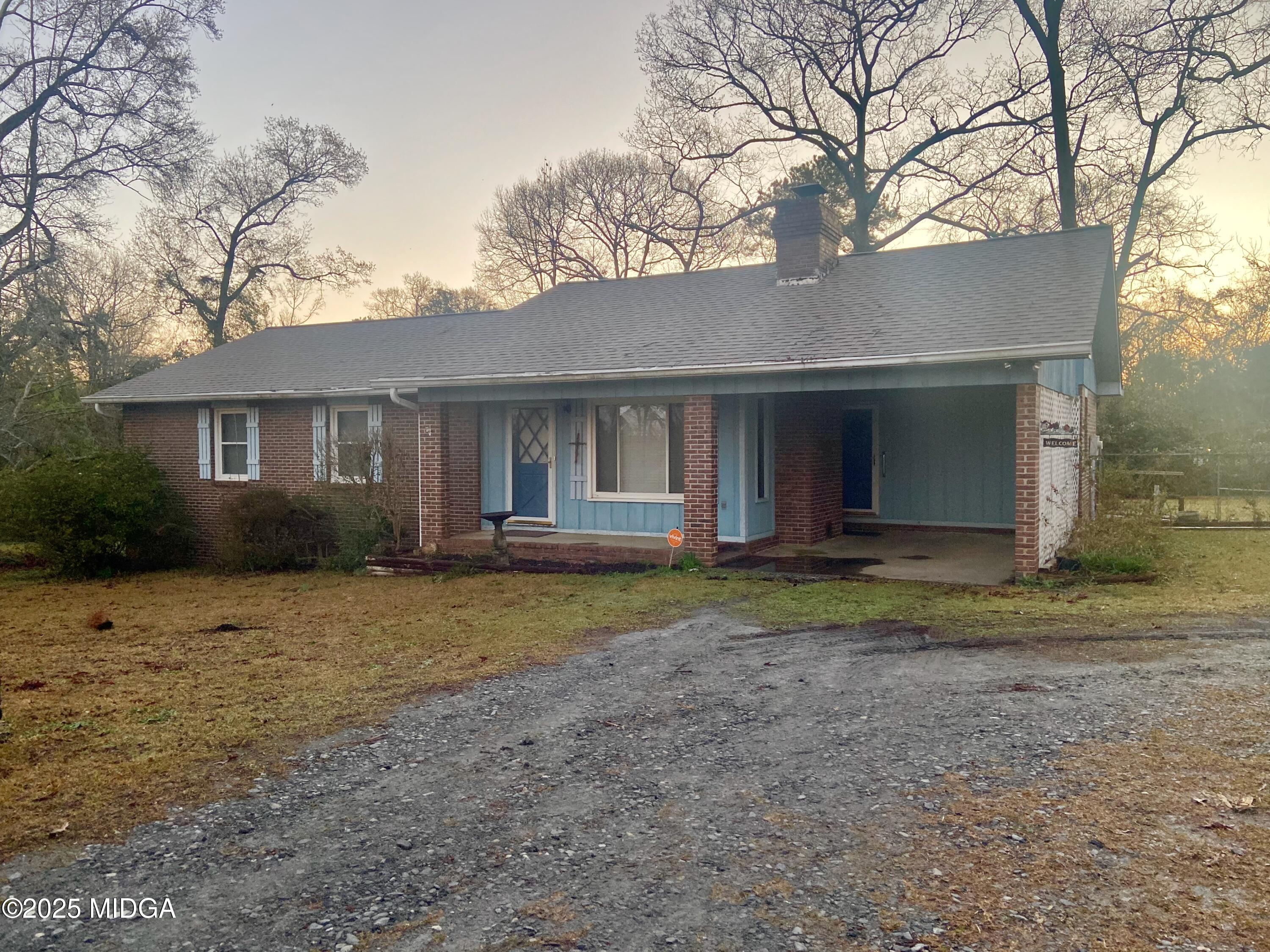 727 Walker Road Byron, GA 31008 - Photo 20 of 23 a view of a house with a yard and large tree