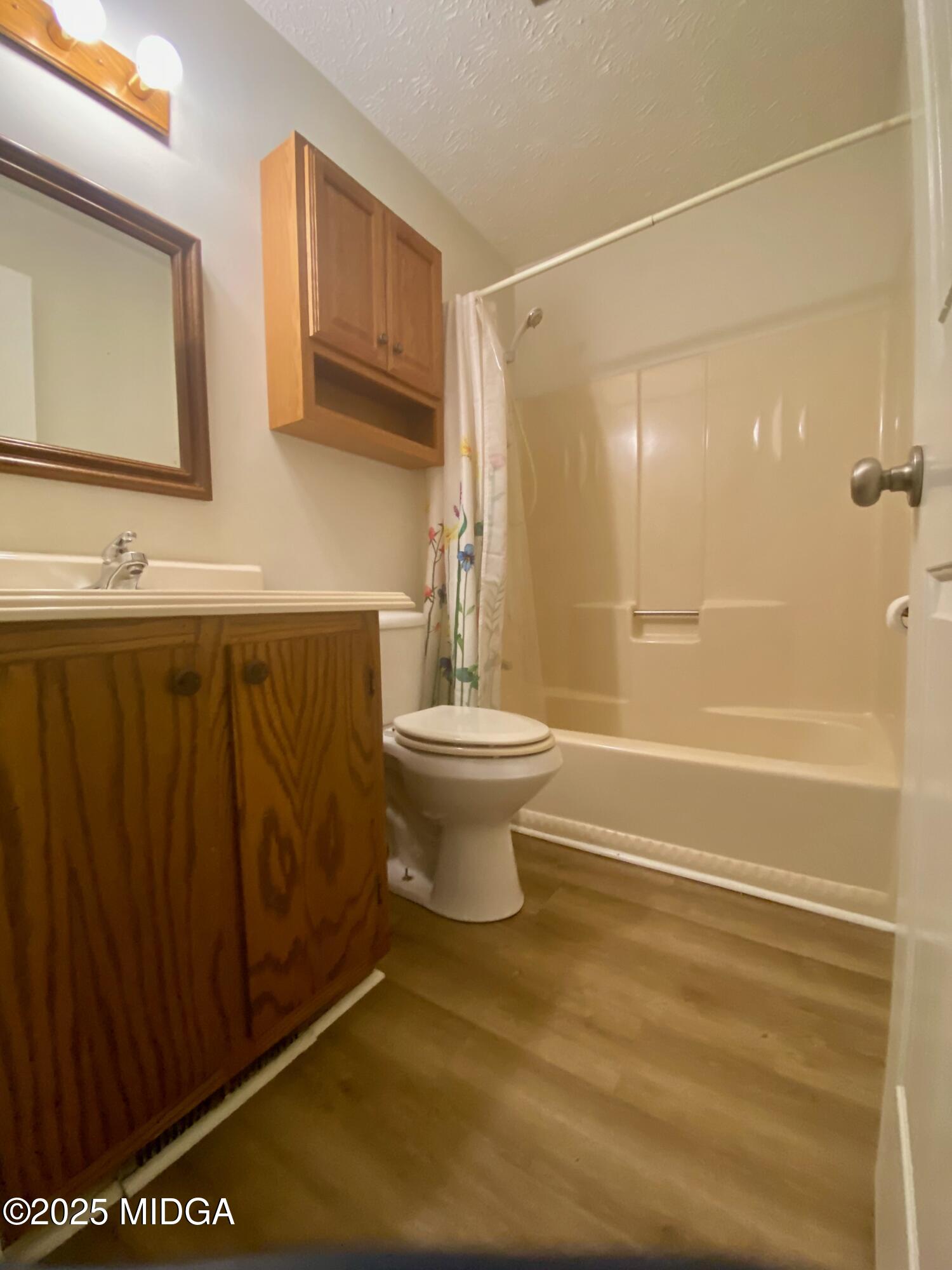727 Walker Road Byron, GA 31008 - Photo 8 of 23 a bathroom with a sink a toilet and shower