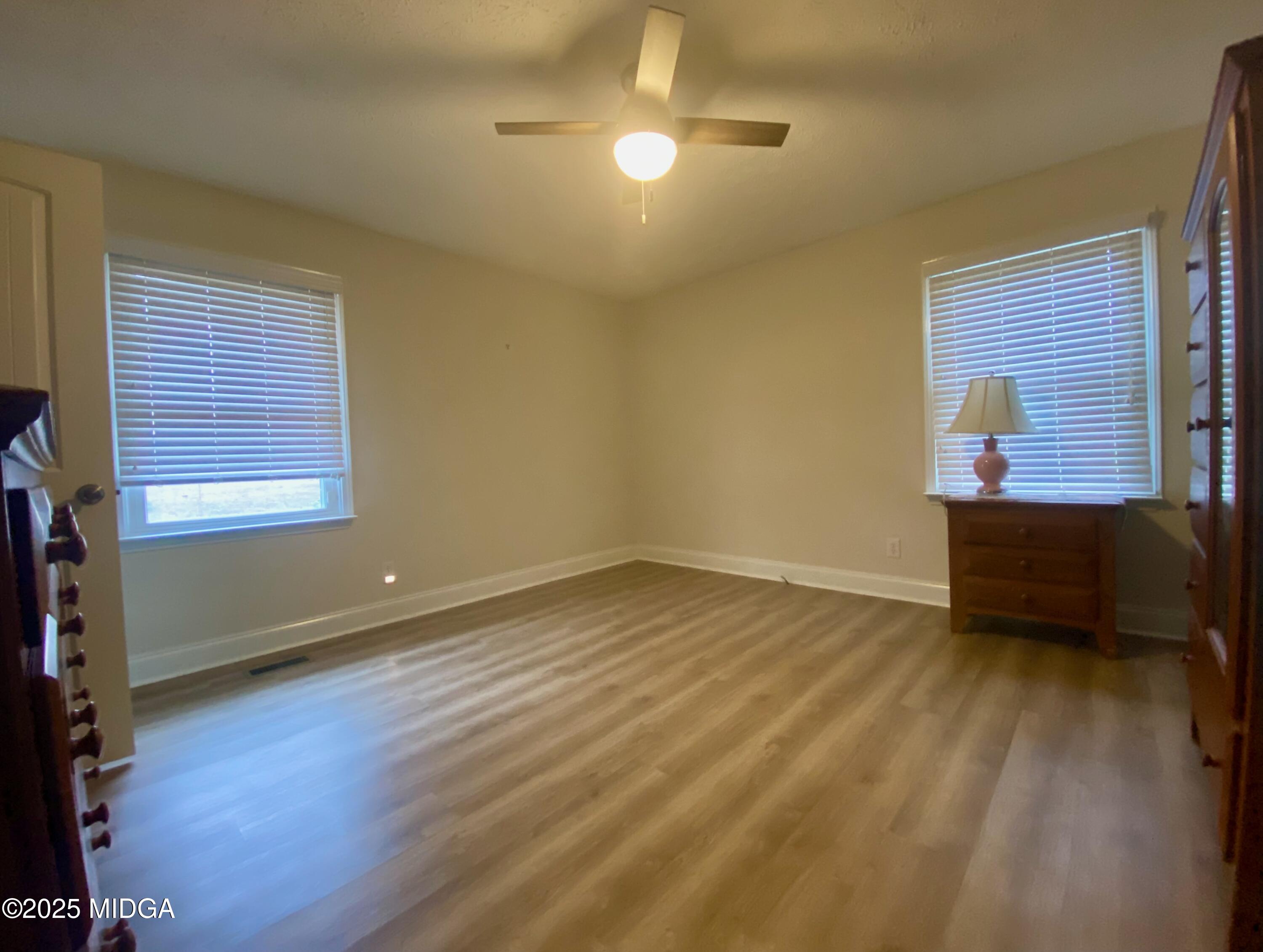 727 Walker Road Byron, GA 31008 - Photo 9 of 23 a view of room with window and hardwood floor
