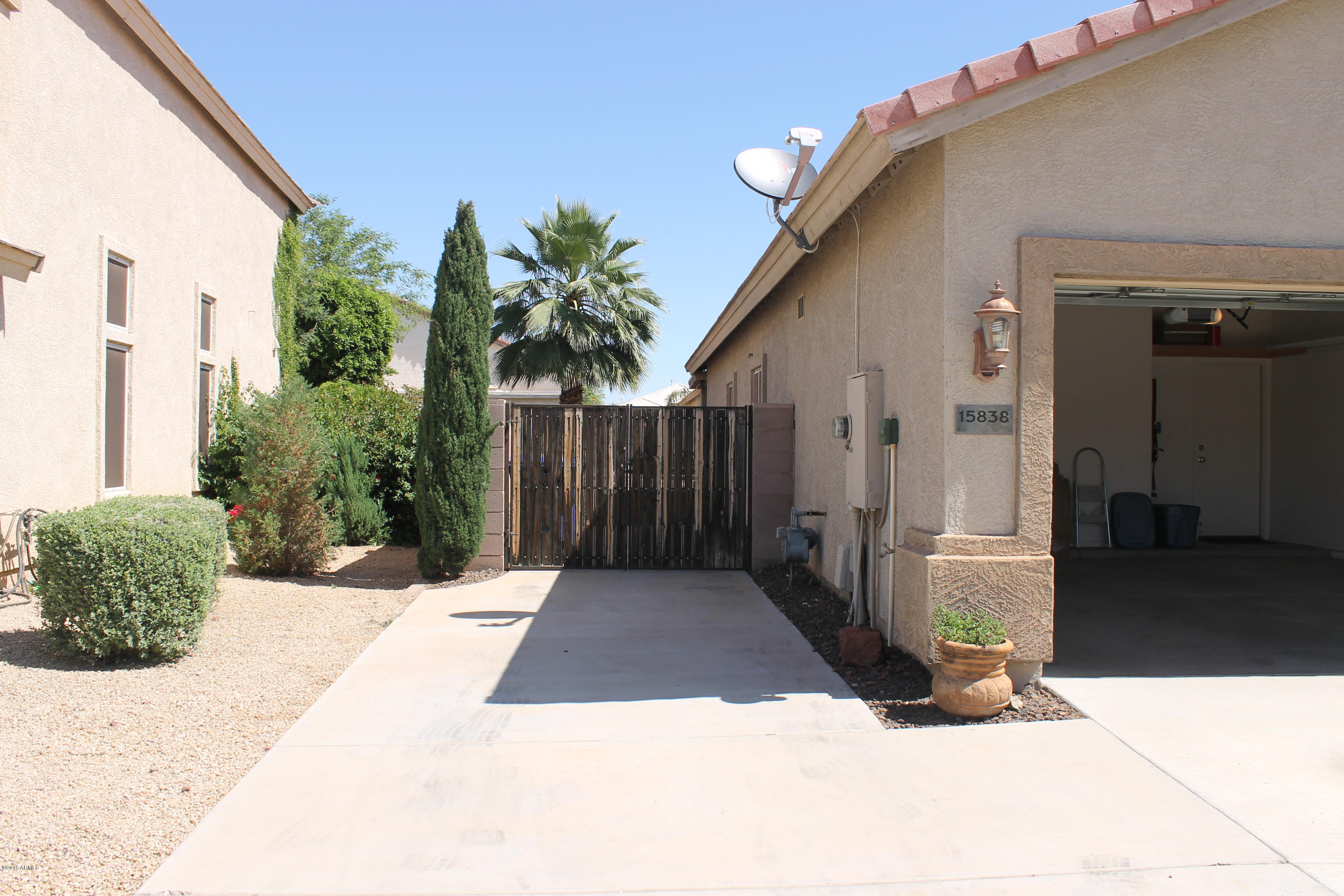 15838 West Boca Raton Road Surprise, AZ 85379 - Photo 9 of 59 Side Gate to rear yard pad
