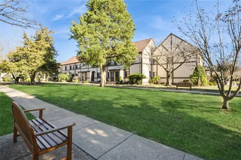 a view of yard with swimming pool and green space