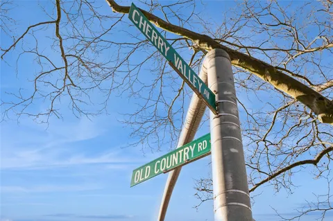 a view of street from balcony