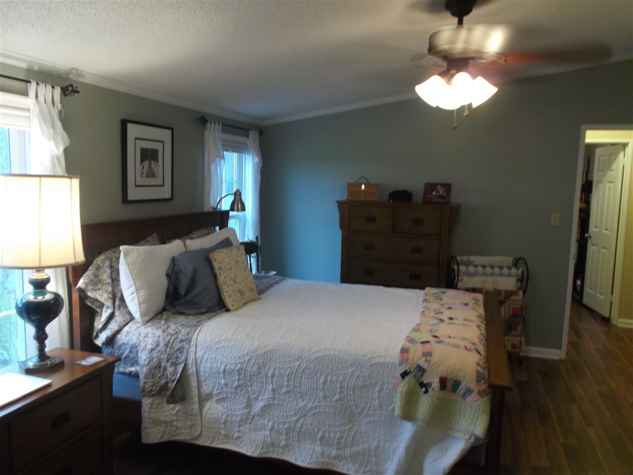 768 Patterson Mill Road Grottoes, VA 24441 - Photo 12 of 17 a bedroom with a bed and a lamp