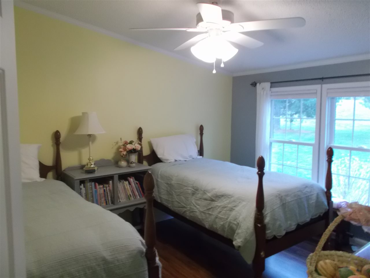 768 Patterson Mill Road Grottoes, VA 24441 - Photo 5 of 17 a bedroom with a bed and a chandelier