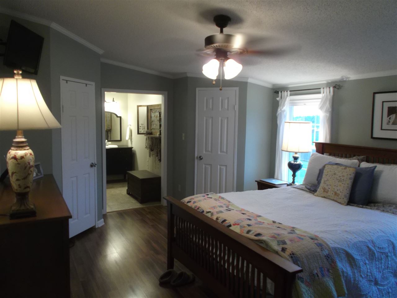 768 Patterson Mill Road Grottoes, VA 24441 - Photo 10 of 17 a bedroom with a bed and a chandelier
