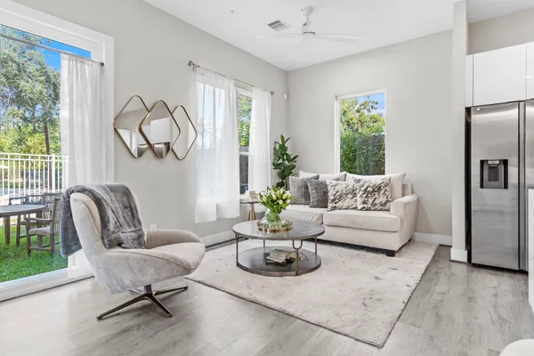 a living room with furniture and a window