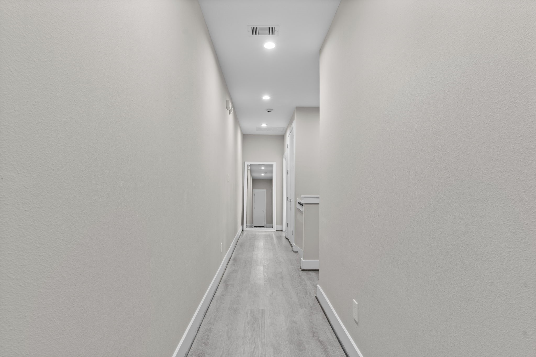 851 Prosper Street Houston, TX 77088 - Photo 30 of 50 a view of a hallway with wooden floor