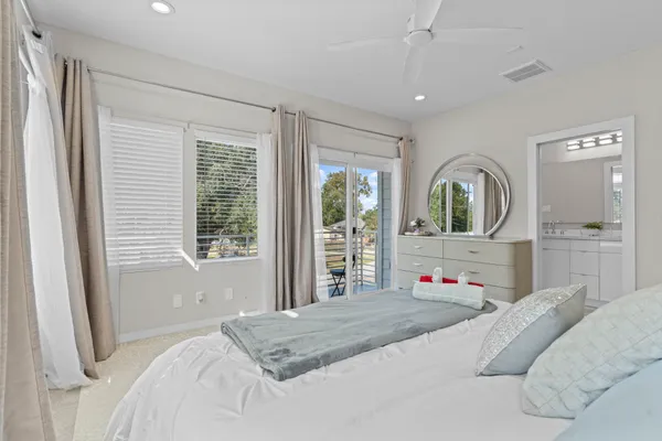 a bedroom with a large bed and a window