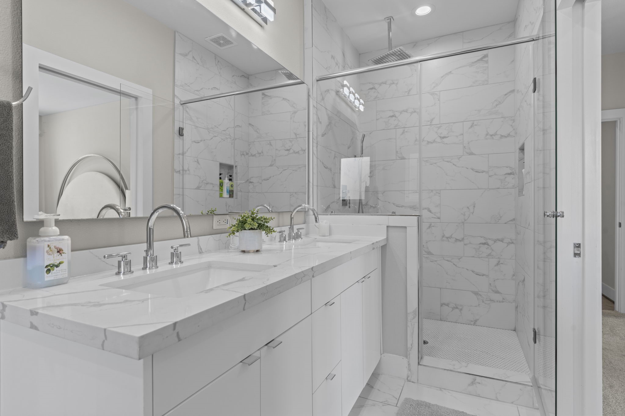 851 Prosper Street Houston, TX 77088 - Photo 41 of 50 a bathroom with a double vanity sink mirror and shower