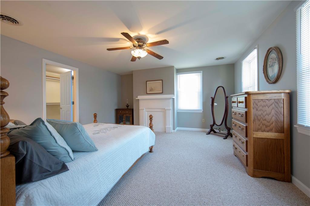 525 Great Belt Road Butler, PA 16002 - Photo 20 of 25 Bedroom #4 with a decorative fireplace and a large walk-in closet.
