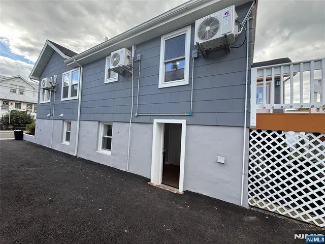 a large room with a kitchen view