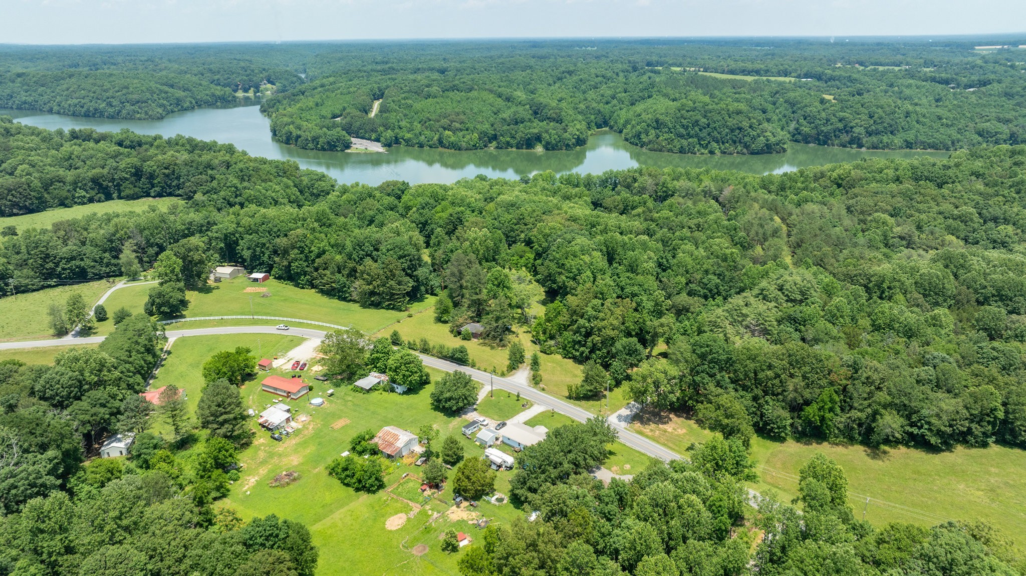7542 Chestnut Ridge Road Winchester, TN 37398 - Photo 2 of 40 a view of a garden with a building in the background