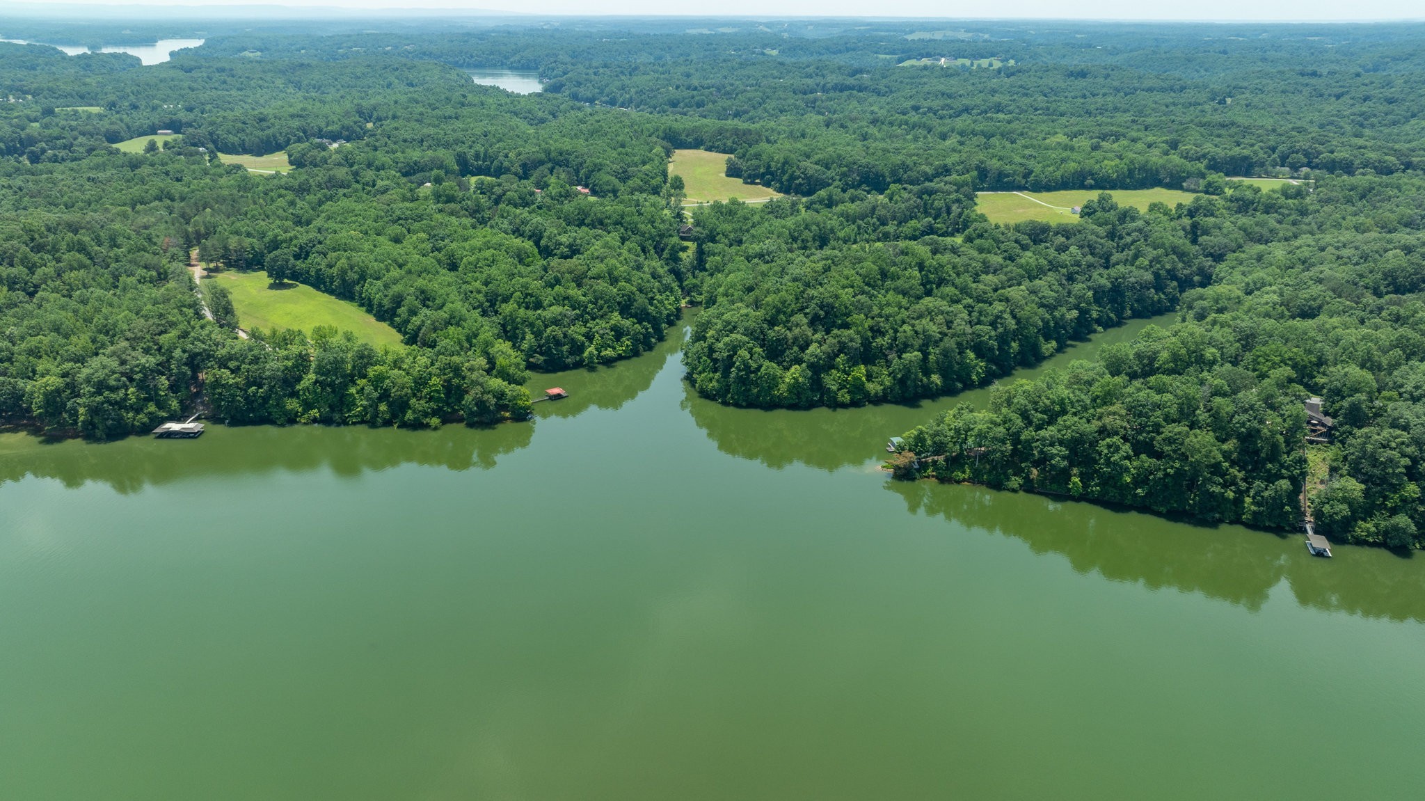 7542 Chestnut Ridge Road Winchester, TN 37398 - Photo 24 of 40 a view of a garden with a building in the background