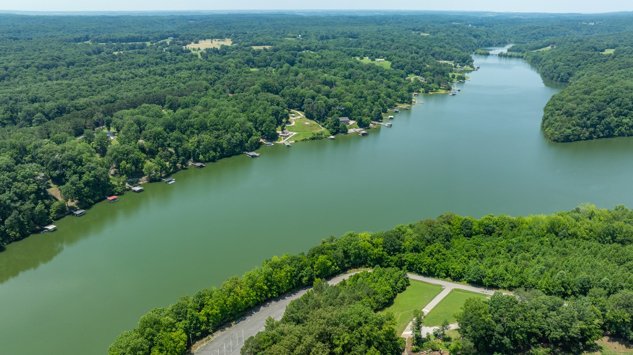7542 Chestnut Ridge Road Winchester, TN 37398 - Photo 26 of 40 an aerial view of green landscape with trees houses and lake view