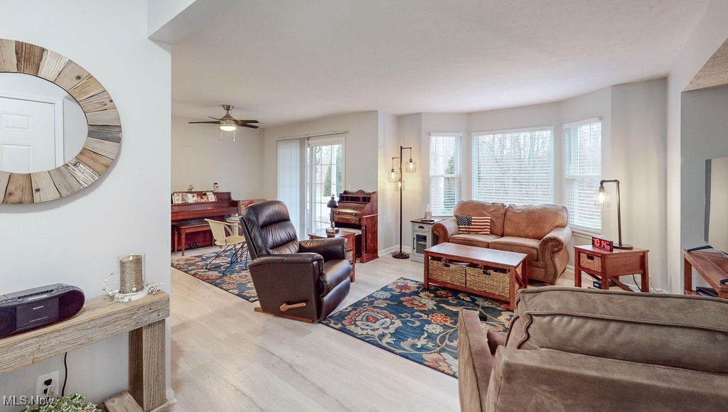 1005 Canyon View Road, Unit F Northfield, OH 44067 - Photo 2 of 28 Living room featuring ceiling fan and light hardwood / wood-style floors