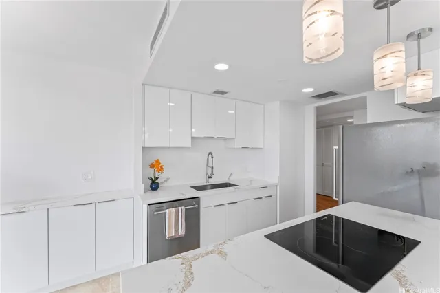 a kitchen with a sink cabinets and window