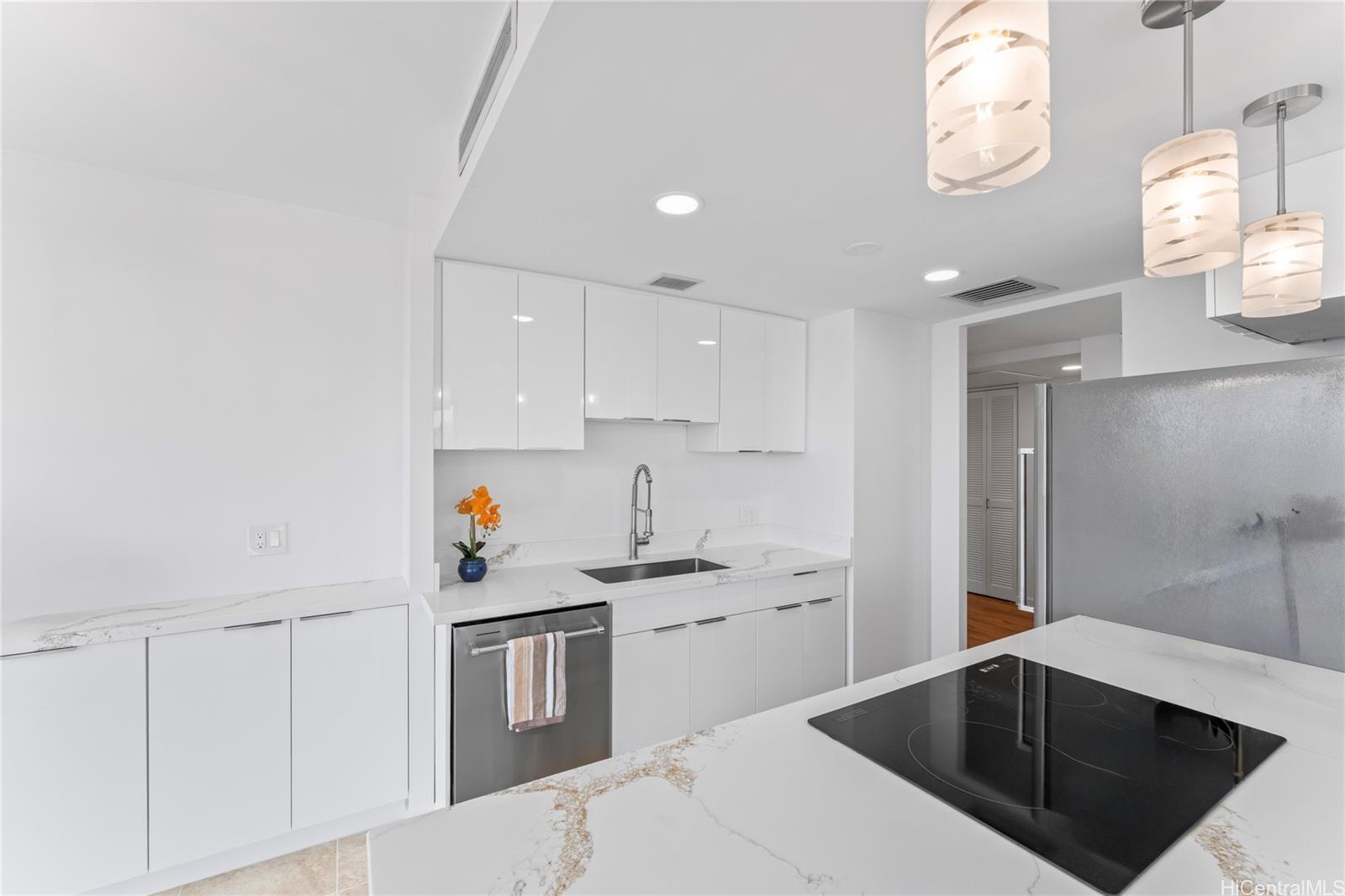 700 Richards Street, Unit 1709 Honolulu, HI 96813 - Photo 11 of 25 a kitchen with a sink cabinets and window