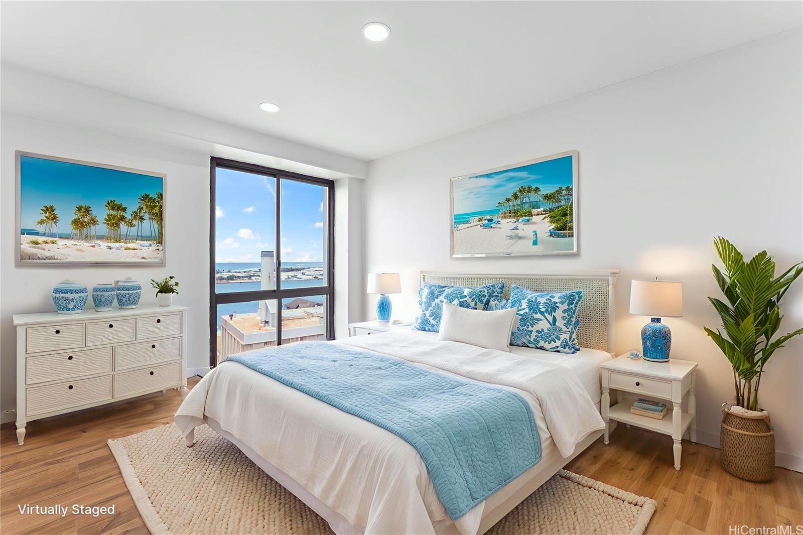 700 Richards Street, Unit 1709 Honolulu, HI 96813 - Photo 12 of 25 a bedroom with a large bed and a window
