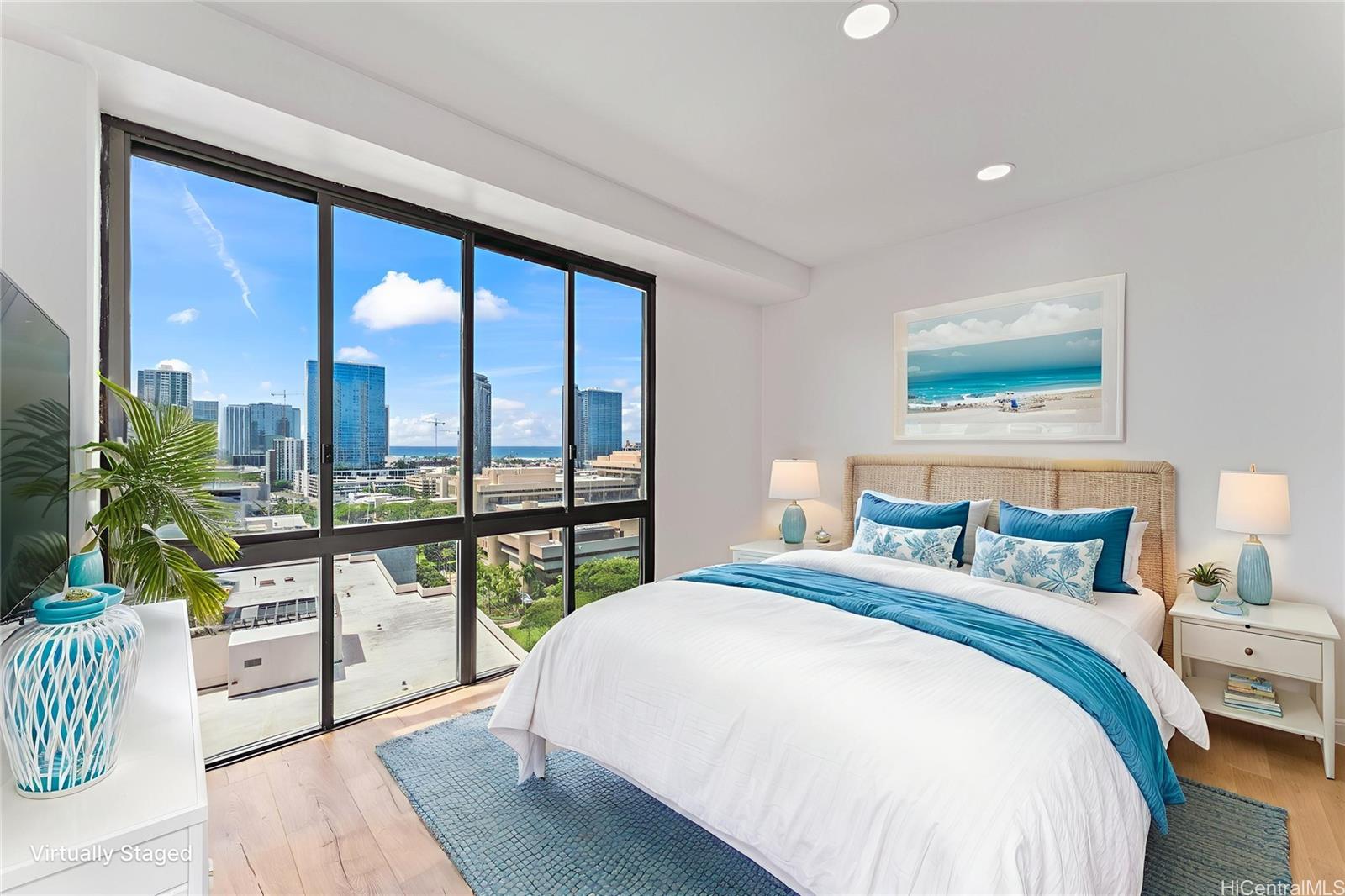 700 Richards Street, Unit 1709 Honolulu, HI 96813 - Photo 17 of 25 a bedroom with a large bed and a large window