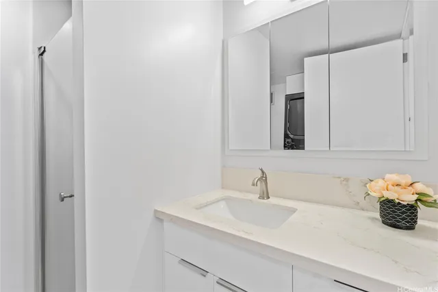 a bathroom with a sink and a mirror