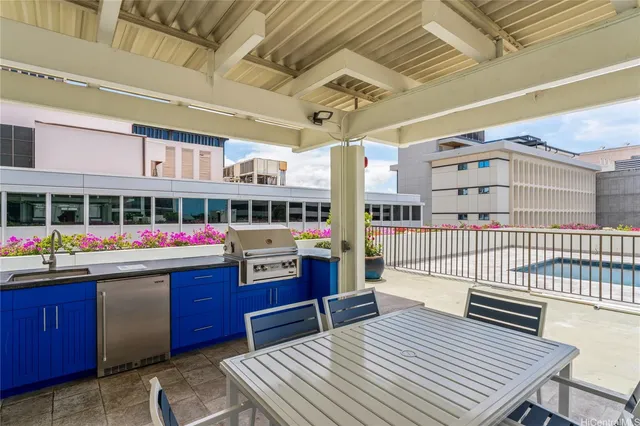 a kitchen view with a stove and a wooden floor