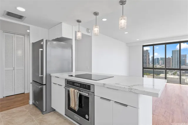 a kitchen with a stove and a refrigerator