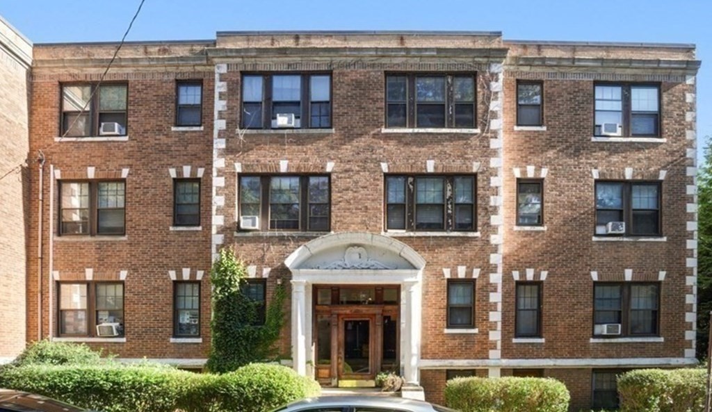 55 Lanark Road, Unit 6 Boston, MA 02135 - Photo 12 of 12 a front view of a building with a garden