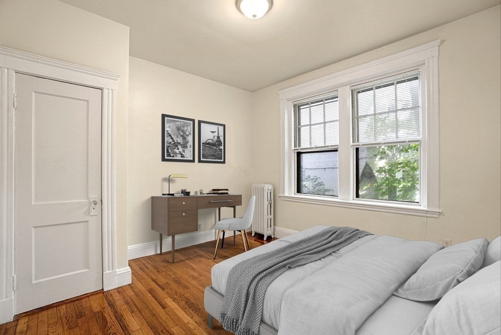 55 Lanark Road, Unit 6 Boston, MA 02135 - Photo 9 of 12 a bedroom with a bed and a window