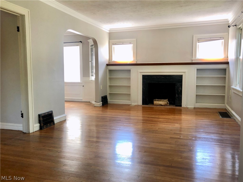 111 Sunset Road Avon Lake, OH 44012 - Photo 5 of 35 Large Living Room with Crown Molding, Built Ins & WB Fireplace