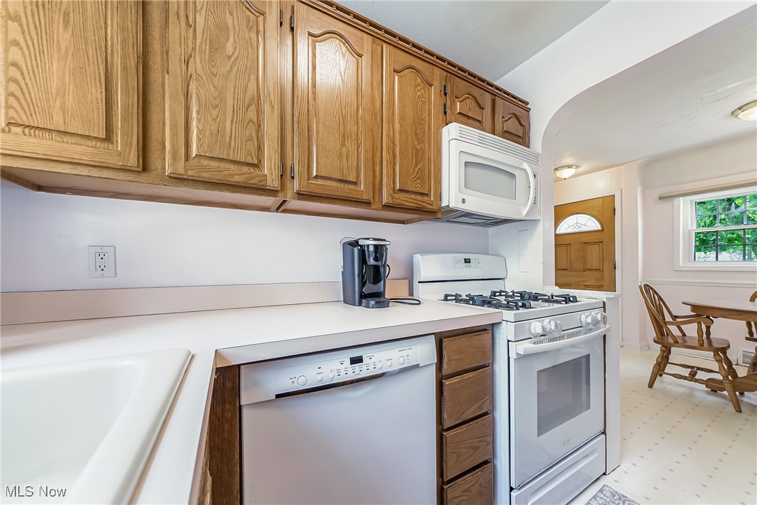 1607 Richmond Road Cleveland, OH 44124 - Photo 8 of 32 Kitchen with sink, white appliances, and light tile patterned floors