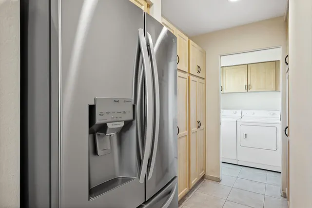 a bathroom with a glass shower door and a sink
