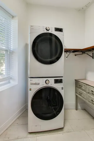 a utility room with washing machine