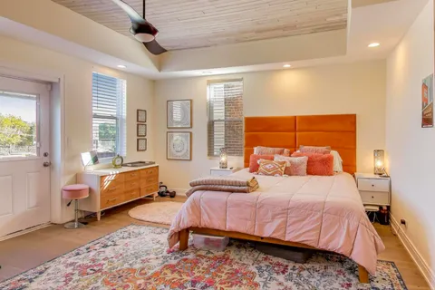 a bedroom with a bed and a couch