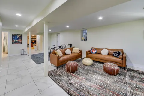a living room with furniture and a rug