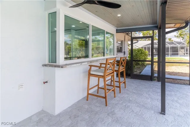 wooden floor in a room with a large window and wooden floor
