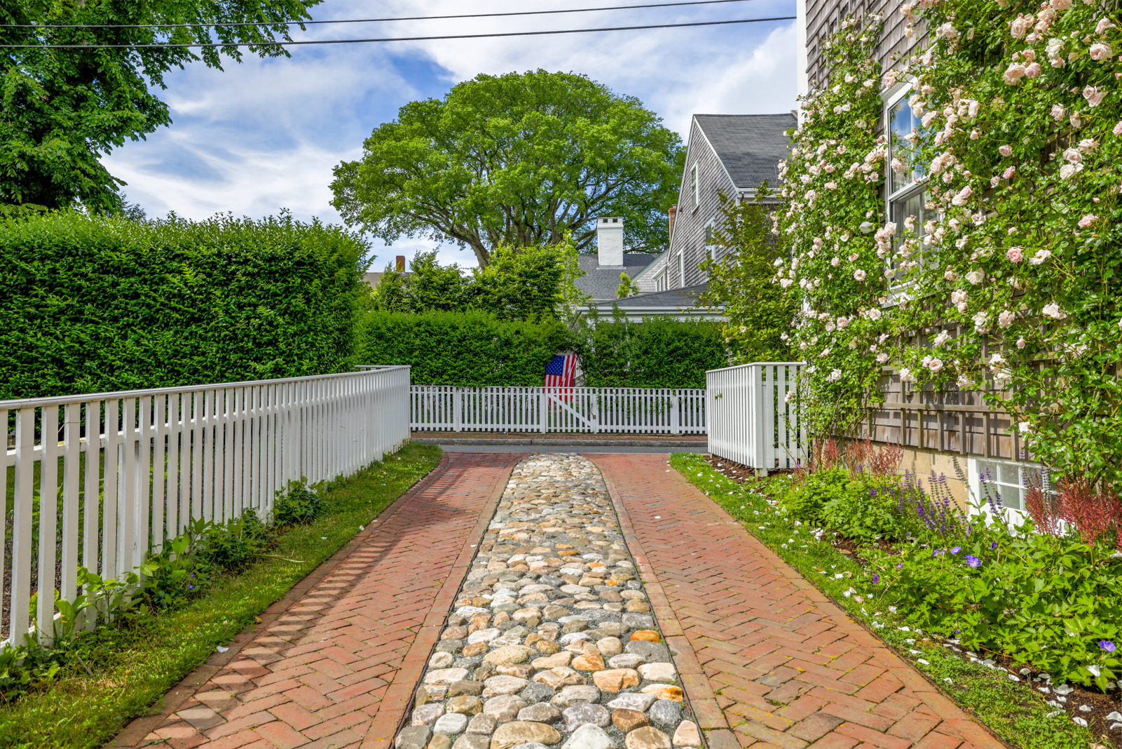 12 Hussey Street Nantucket, MA 02554 - Photo 41 of 47 a view of small garden with wooden fence