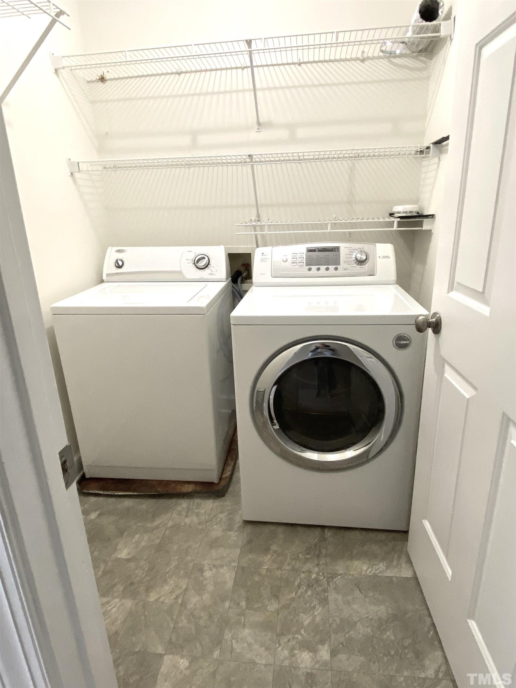 4313 Fowler Ridge Drive Raleigh, NC 27616 - Photo 19 of 30 a utility room with dryer and washer