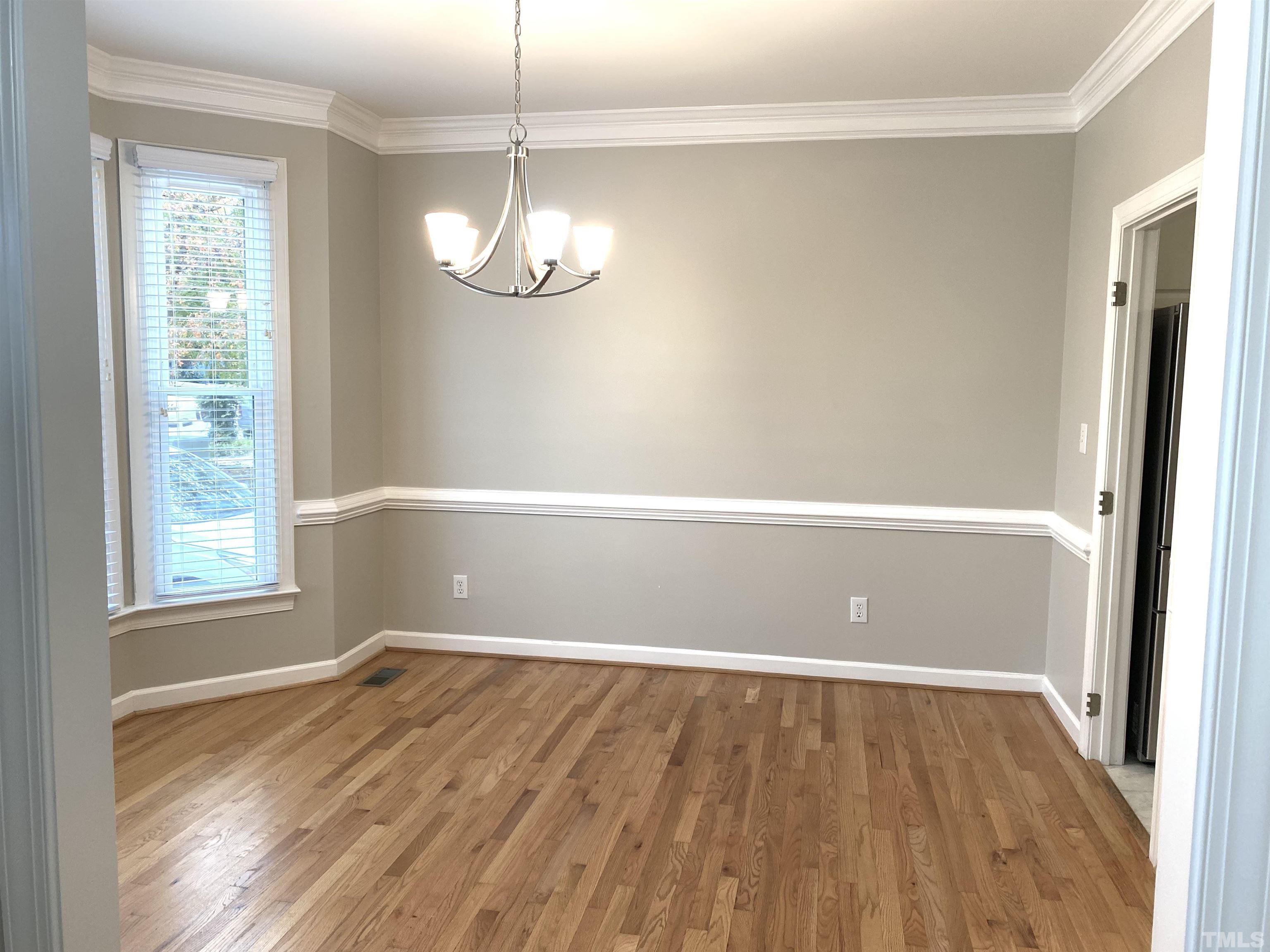 4313 Fowler Ridge Drive Raleigh, NC 27616 - Photo 3 of 30 a view of empty room with wooden floor and fan