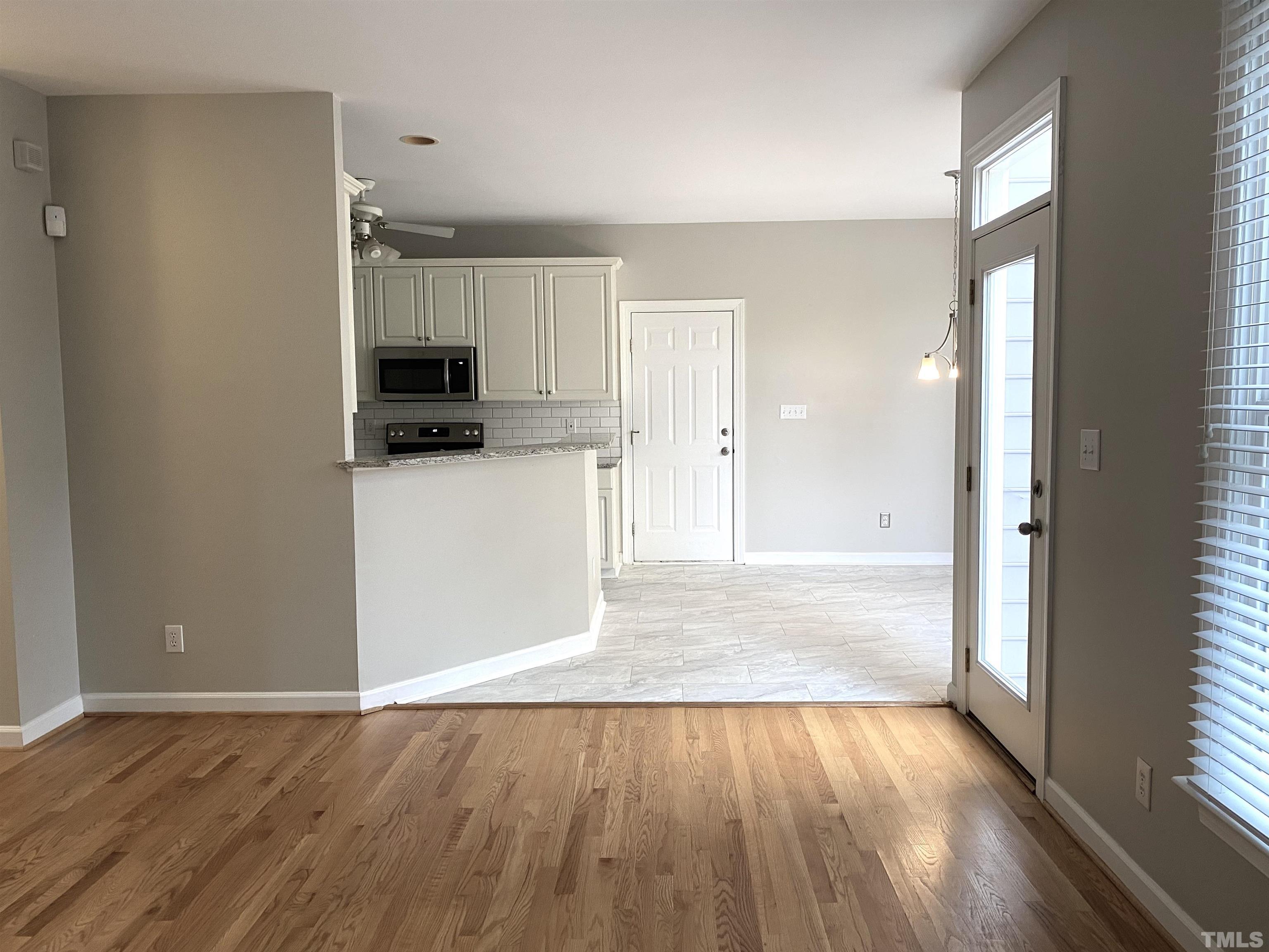 4313 Fowler Ridge Drive Raleigh, NC 27616 - Photo 8 of 30 a view of a kitchen with wooden floor